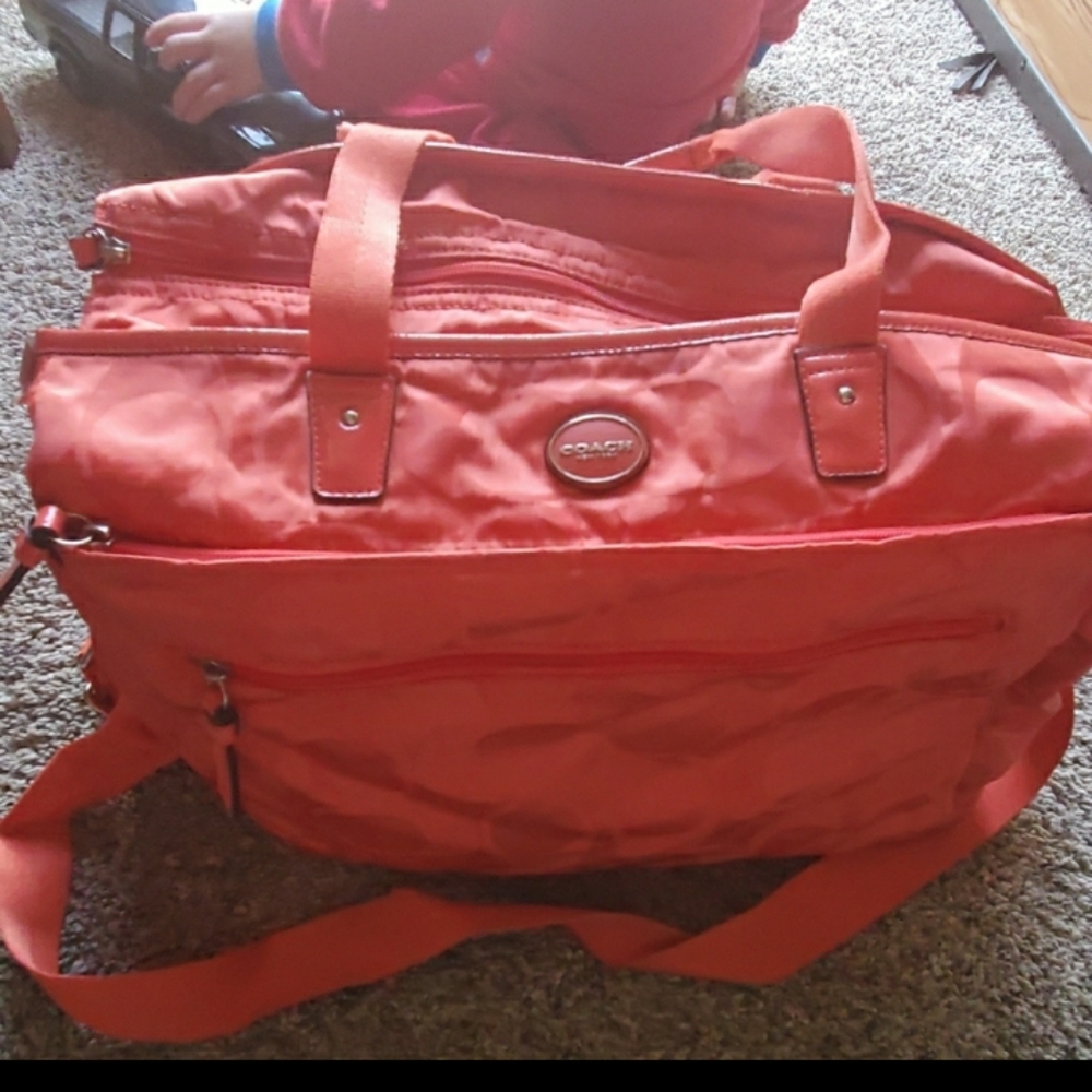 Coach diaper/ Missing bottom support. I wore it as a purse.